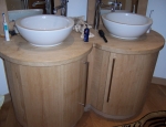 Twin bathroom cabinets with basin